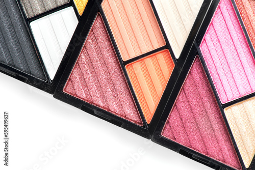Makeup palette set isolated on white background. Professional multicolor eyeshadow palette. Makeup. Professional multicolor eye shadow make-up palette, close-up. Various Colorful bright eye shadows