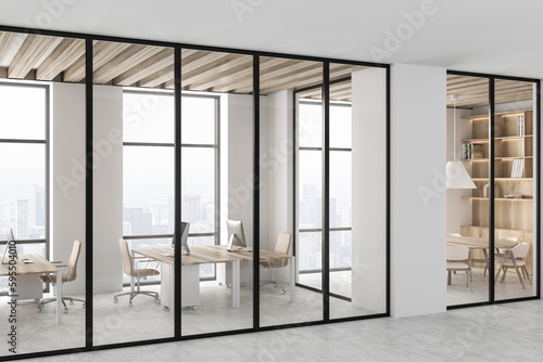 Light office room interior with coworking and meeting corner, panoramic window