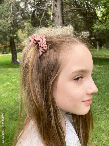 portrait of a little girl with a crown of dandelion fluff