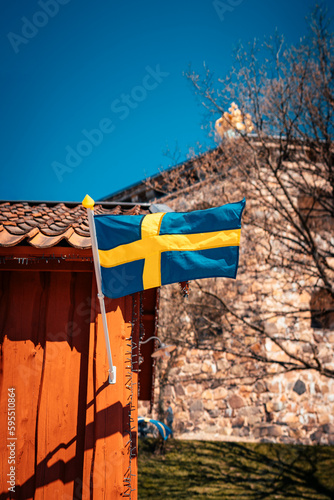 Swedish flag waving on a beautiful summer day in Gothenburg, Sweden.