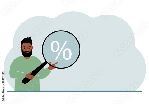A man shows a percent sign through a magnifying glass.