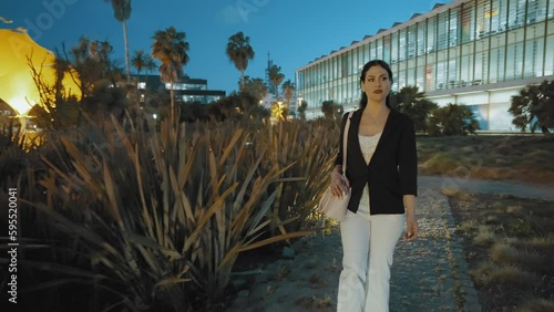 Attractive Woman walking in business outfit