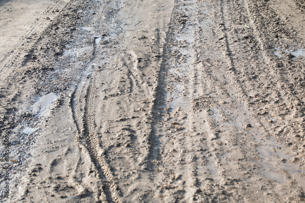 Mud, puddles, a country road after rain. Soggy ground. Mud, puddles, a country road after rain. Soggy ground.