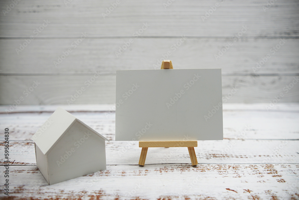 House model with space copy on wooden background