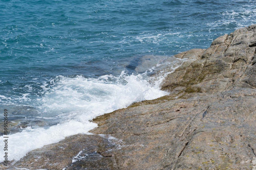 waves of the blue sea crash against the rocks waves of the blue sea crash against the rocks