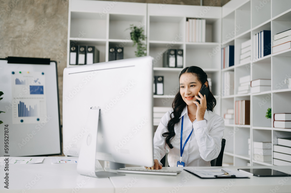 Happy asian business woman have the joy of talking on the smartphone, tablet and laptopon the office .. Happy asian business woman have the joy of talking on the smartphone, tablet and laptopon the office ..