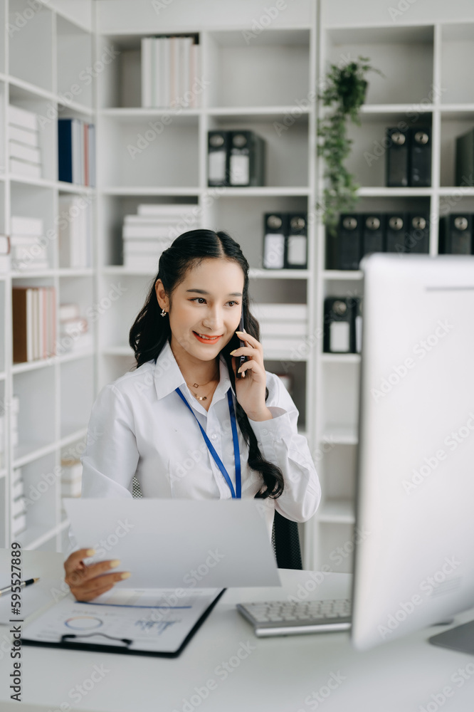 Happy asian business woman have the joy of talking on the smartphone, tablet and laptopon the office .. Happy asian business woman have the joy of talking on the smartphone, tablet and laptopon the office ..