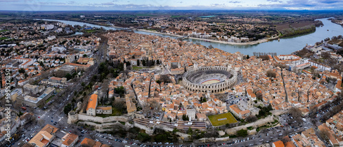 Aerial around the old town of Arles on a sunny day on a late afternoon in early spring. 