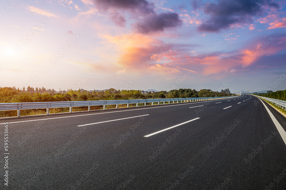 Fototapeta premium Asphalt highway road and sky clouds background