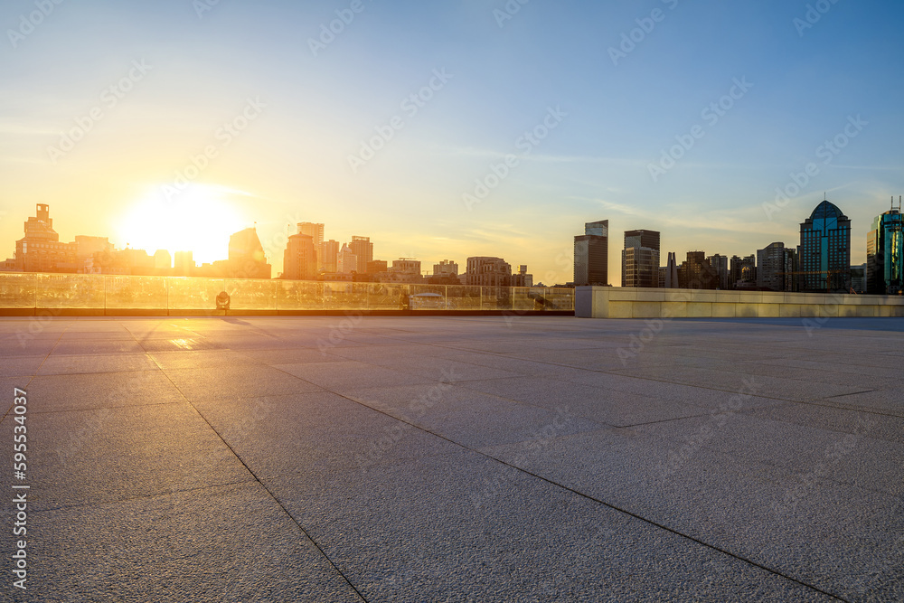 Empty floor and city skyline with building at sunset in Shanghai, China.