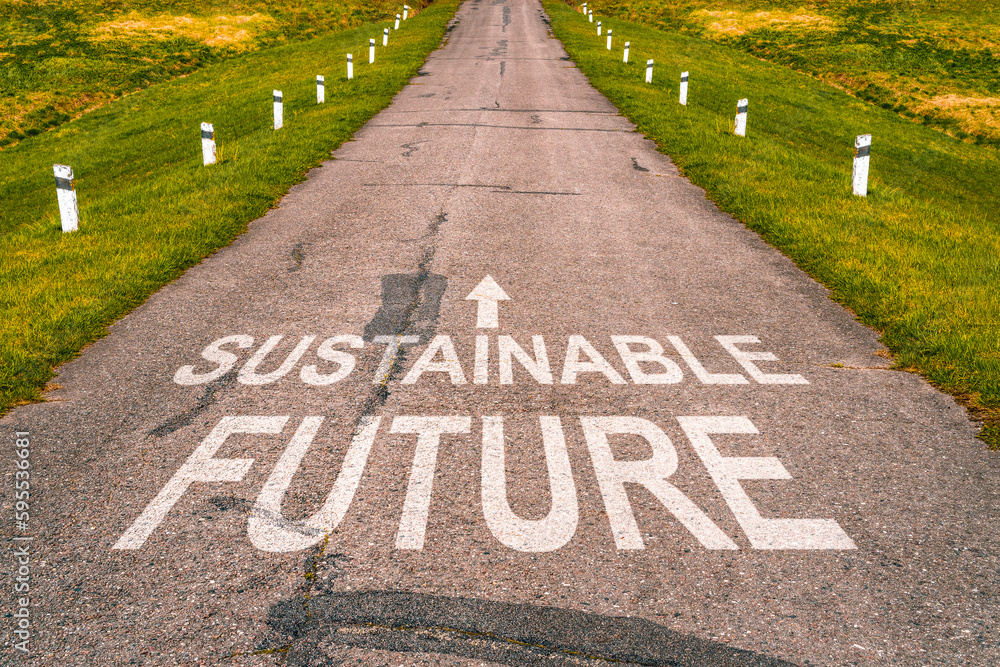 Obraz premium Sustainable future lettering on asphalt road surface