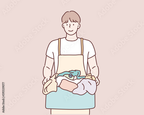  man holding laundry basket and detergent bottle. Hand drawn style vector design illustrations.