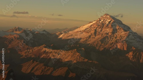 Aconcagua Peak from Andes Mountains at sunset. 4K aerial video with the amazing sunset landscape over the tallest peaks in South America, part of Andres Mountains. photo