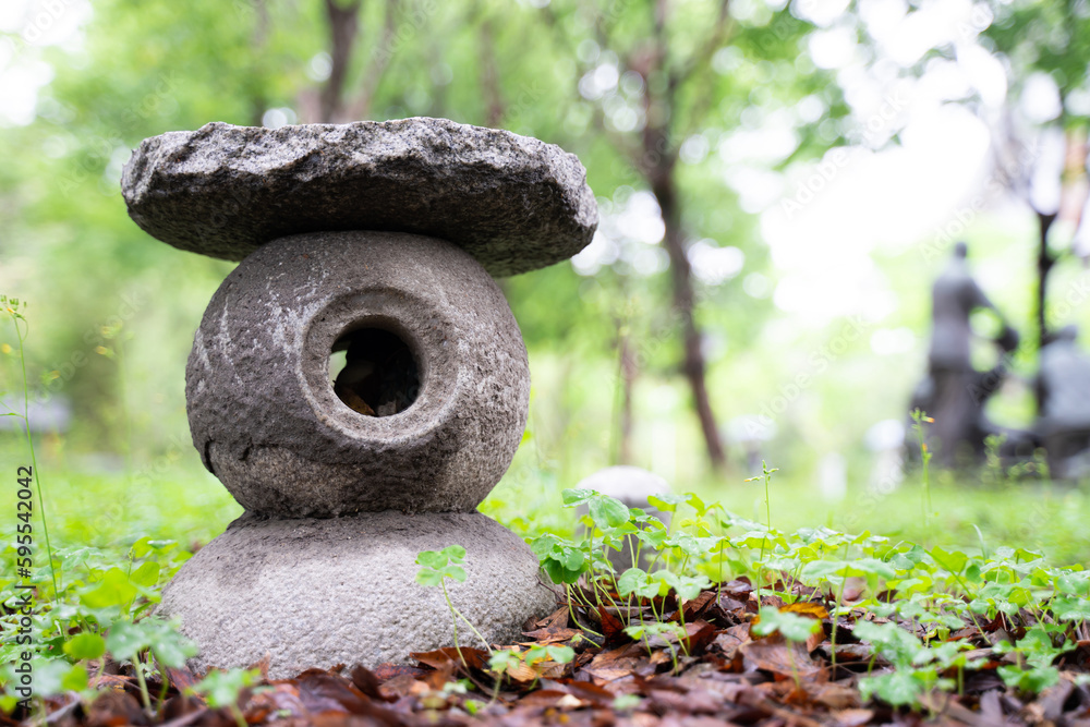 Stone chair set outdoors. Round shape, chic design, set in the garden Stone chair set outdoors. Round shape, chic design, set in the garden