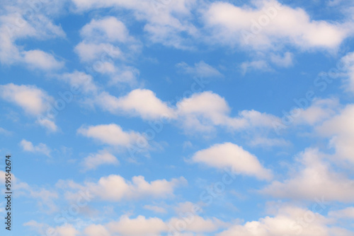 Background of fluffy cumulus clouds, slightly softened to enhance the soft impression