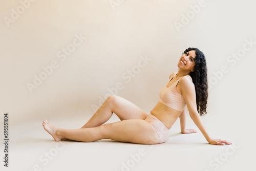Beautiful woman posing in her underwear smiling