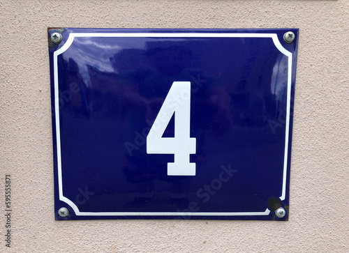 Blue metal sign with the number 4