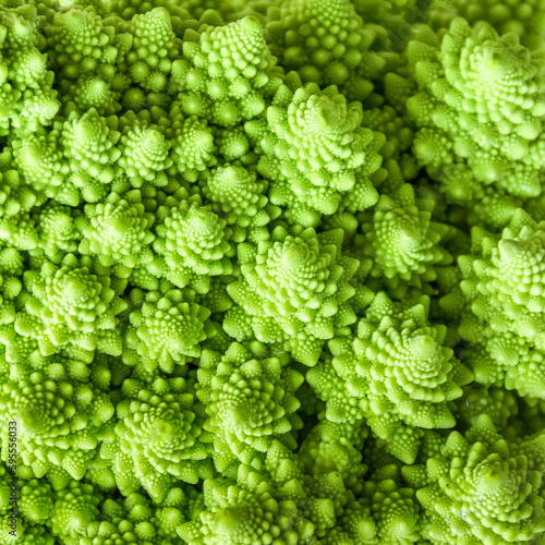 Green vegetables. Detail of Romanesque cauliflower. Healthy food concept.