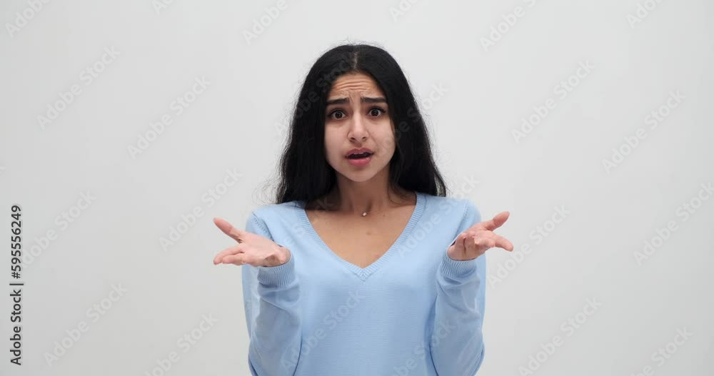 Confused perplexed woman gesturing with her head in hand Confused perplexed woman gesturing with her head in hand