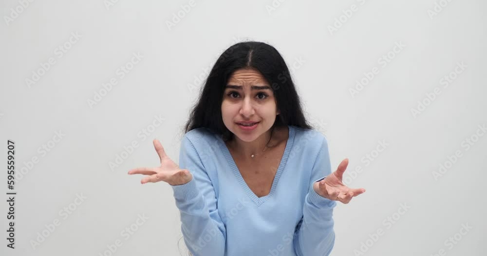 Frustrated young woman screaming while arguing and speaking in annoyance Frustrated young woman screaming while arguing and speaking in annoyance