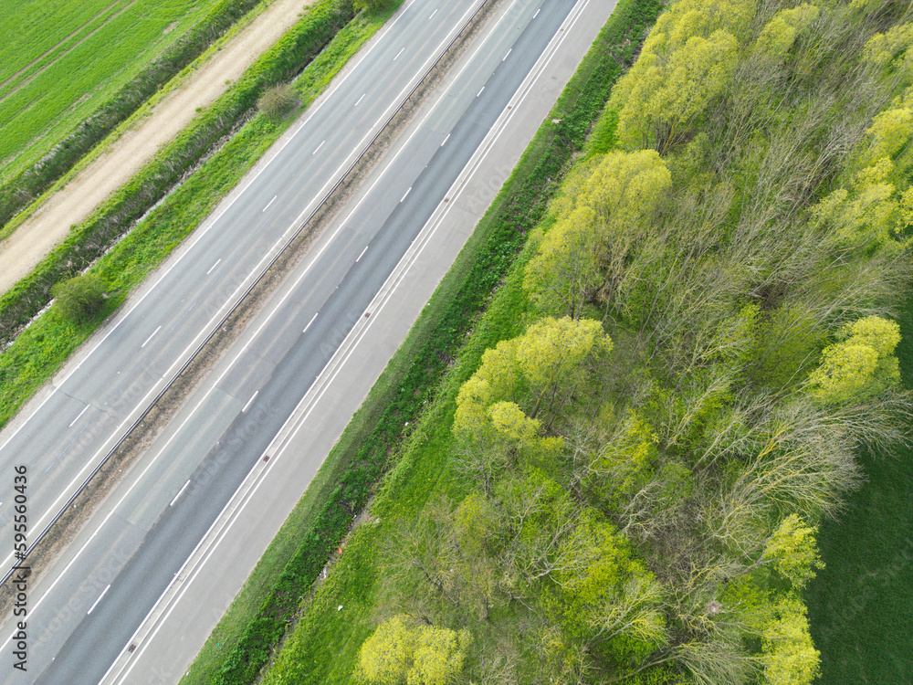 Drone view of part of anEnglish dual carriage way shown in the East Anglian countryside.