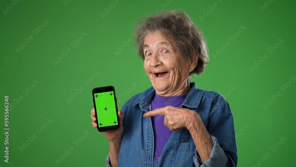 Funny Crazy Elderly Old Toothless Woman Points To Phone With Green funny-crazy-elderly-old-toothless-woman-points-to-phone-with-green