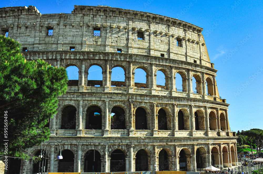 Section of, damaged, Roman Colosseum, against a clear, blue sky, in April