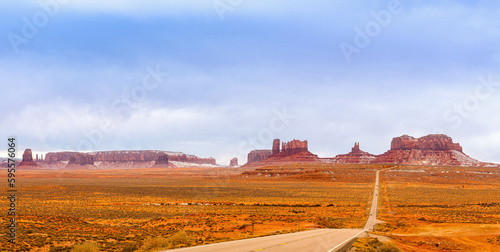 View of Monument Valley from Forrest Gump Point ( US-163 ). Scenic road in the desert with Red Rocky Mountains in Background. Forrest Gump Point in Oljato-Monument Valley, Utah, United States.