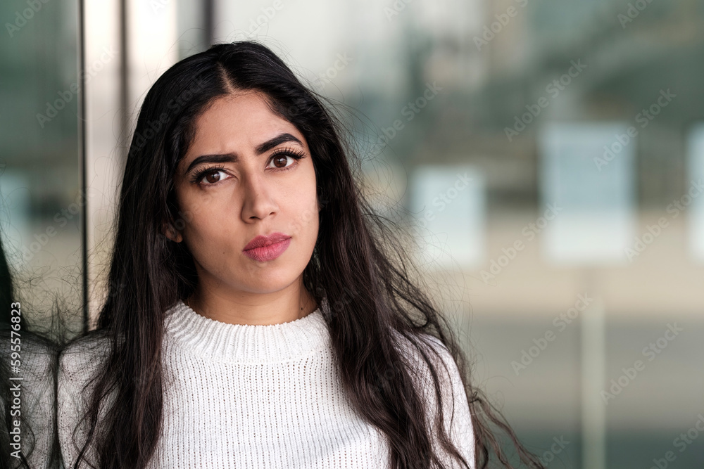 Portrait of young indian woman looking at camera. Portrait of young indian woman looking at camera.