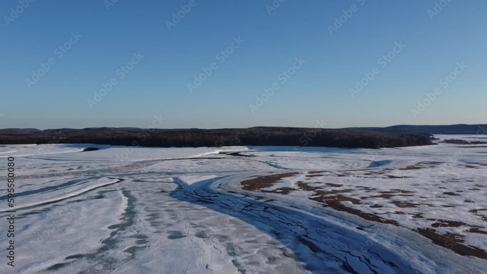 View of a large river in the Canadian countryside in spring View of a large river in the Canadian countryside in spring