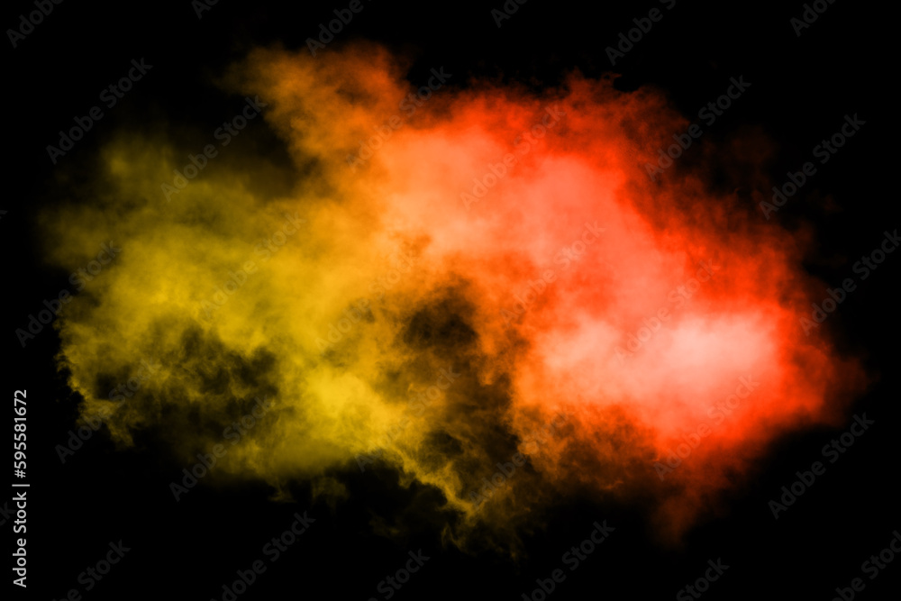 Colored powder explosion on black background. Freeze motion of colored powder explosion isolated.