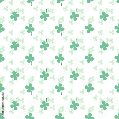 Cute pastel green clovers are surrounded by small green tone clovers background  a seamless pattern that looks beautiful  bright and attractive.