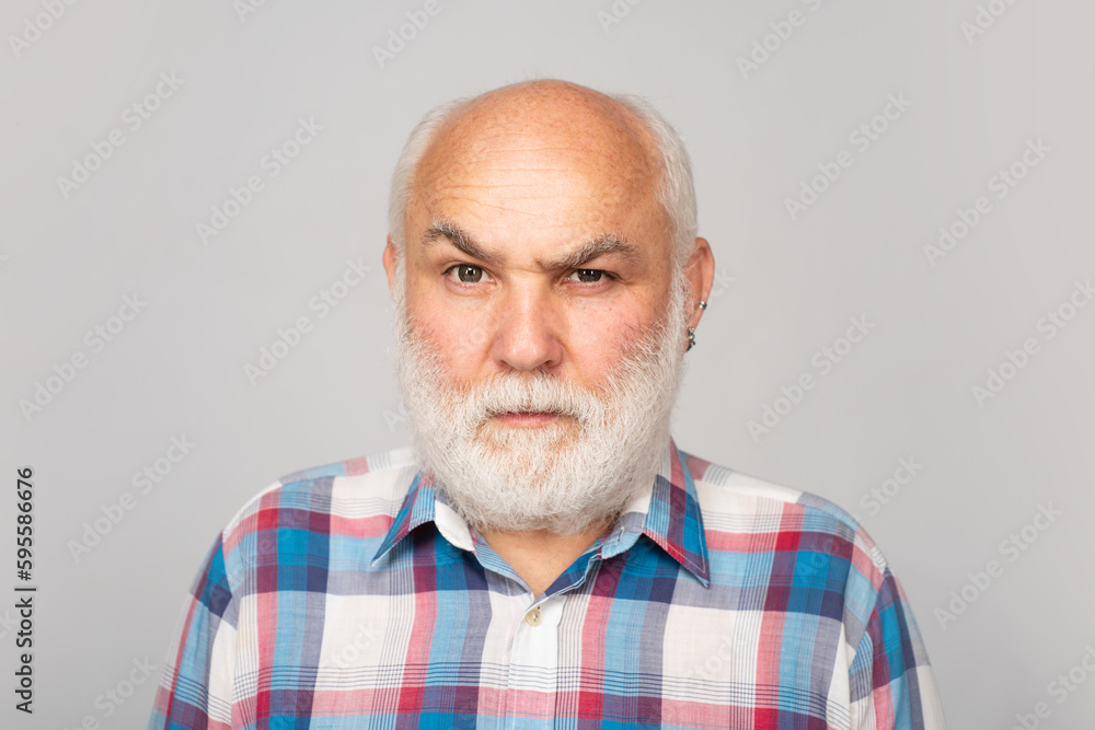 Obraz premium Mature man. Close up face of handsome serious elder senior in studio. Older grandfather, grandpa pensioner, retiree concept.