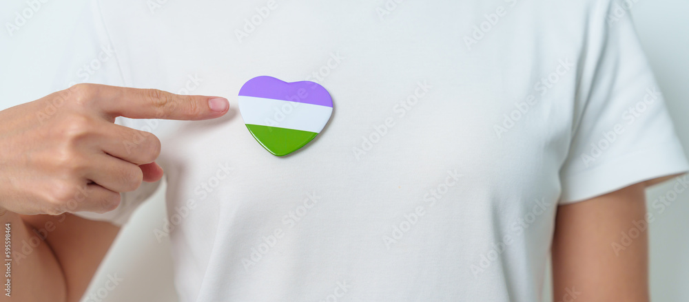 Queer Pride Day and LGBT pride month concept. purple, white and green heart shape for Lesbian, Gay, Bisexual, Transgender, genderqueer and Pansexual community Queer Pride Day and LGBT pride month concept. purple, white and green heart shape for Lesbian, Gay, Bisexual, Transgender, genderqueer and Pansexual community
