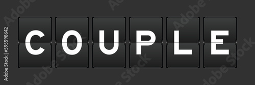 Black color analog flip board with word couple on gray background