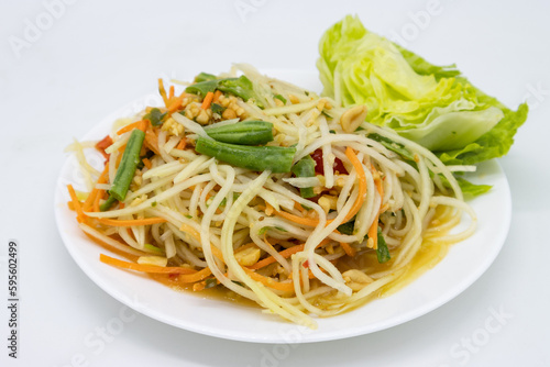 Thai Style Som Tum Papaya Salad on a White Plate