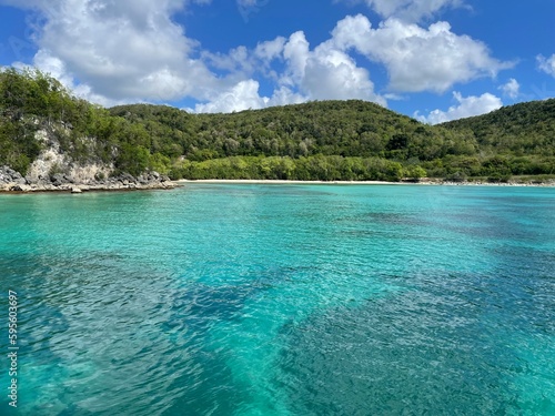 Beautiful Caribbean Bay with the Beach Moustique on Marie Galante, a small island next to the Caribbean Island of Guadeloupe. The water is cristal clear, the weather is beautiful. Perfect swim weather