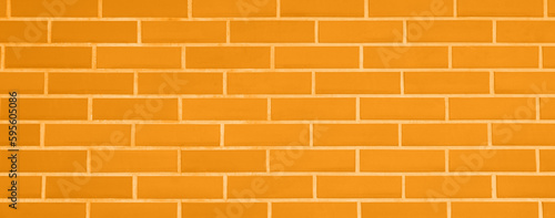 Texture of bright orange brick wall as background, banner design