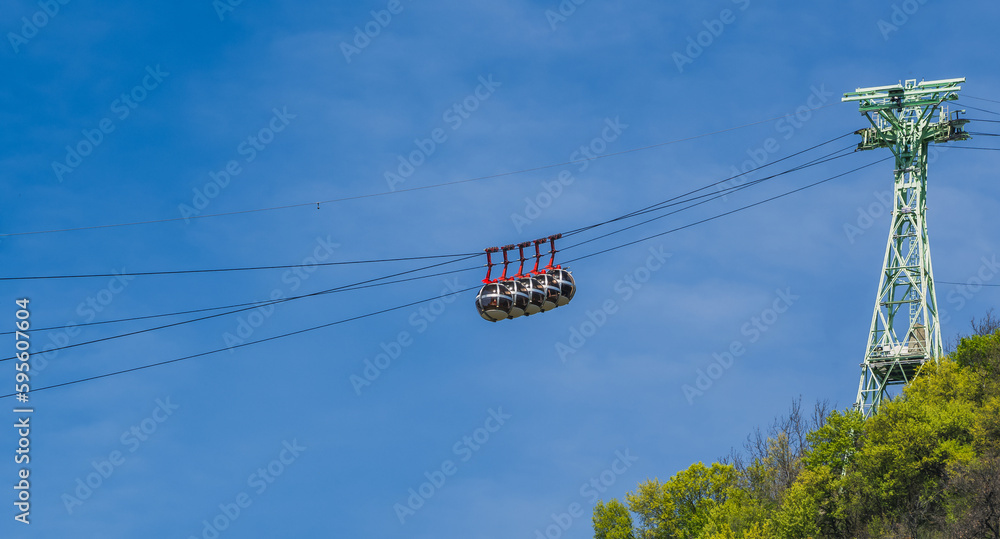 Gondola bubbles against the blue sky. Cable car taking tourists to Fort de La Bastille in Grenoble, France