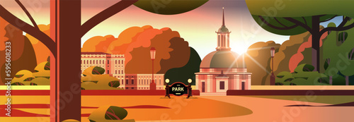 front view of administrative governmental traditional classic building and church in public autumn city park