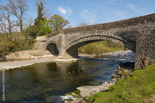 A stone bridge over the Rawthey River in Sedbergh. Yorkshire, UK. photo