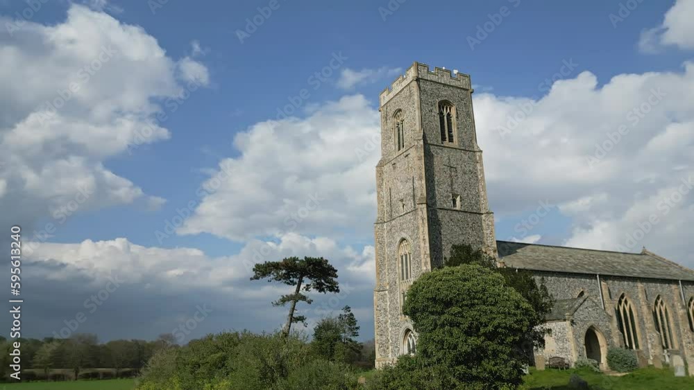 Honing, Norfolk, UK – April 22 2023. Low down aerial orbit footage of the church of St Peter and St Paul in the Norfolk village of Honing Honing, Norfolk, UK – April 22 2023. Low down aerial orbit footage of the church of St Peter and St Paul in the Norfolk village of Honing