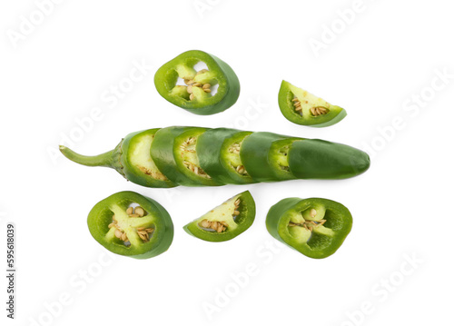 Whole and cut green hot chili peppers on white background, flat lay