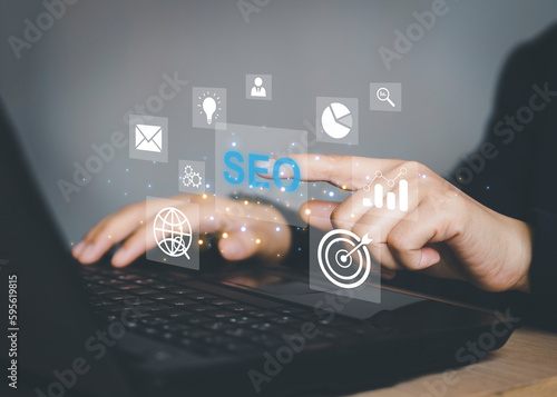 Businessman using a computer for analysis SEO Search Engine Optimization Marketing Ranking Traffic Website Internet Business Technology Concept.