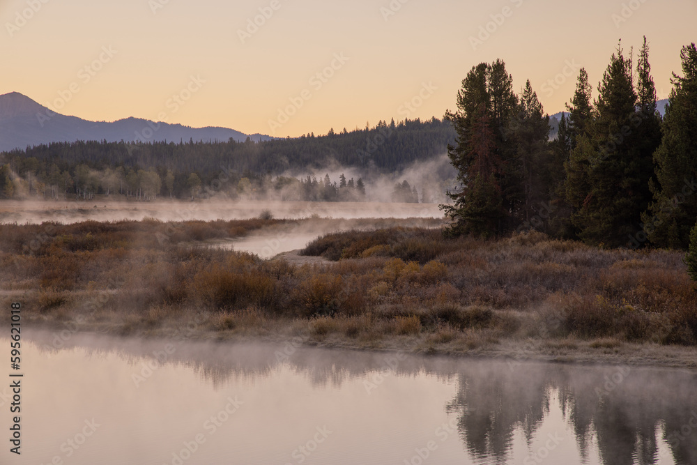 Beautiful Sunrise Landscape Reflection in the Tetons in Autumn Beautiful Sunrise Landscape Reflection in the Tetons in Autumn