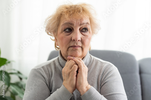 an old woman is praying