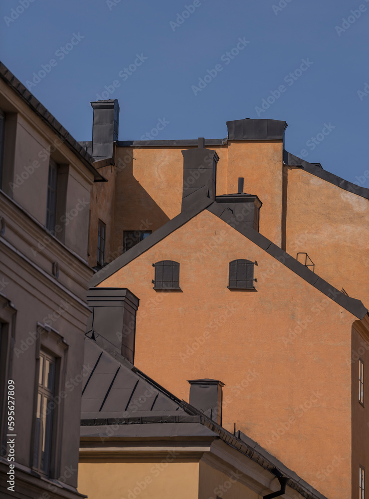 Facades of old houses on the hill Maria Berget, a sunny day in Stockholm