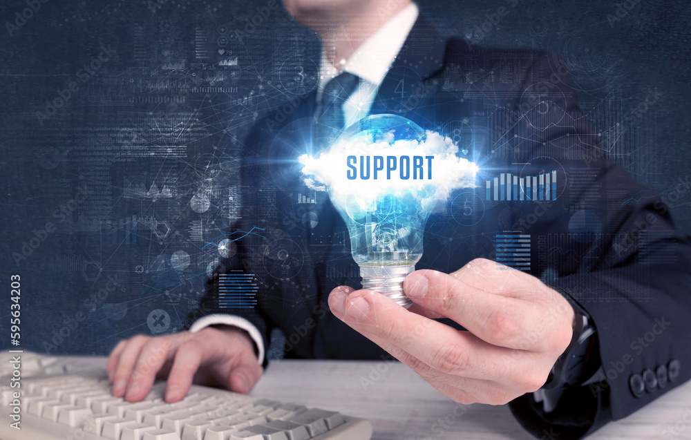 Businessman holding a light bulb, business concept Businessman holding a light bulb, business concept