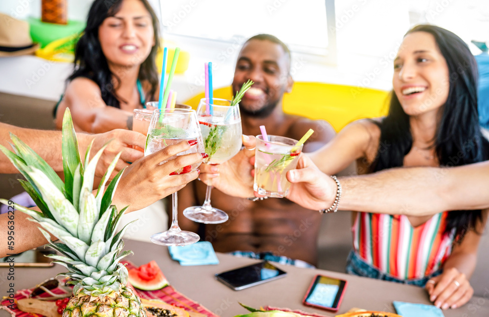 Trendy people toasting fancy cocktails at boat party trip - Young millenial friends having fun on luxury vacation - Travel life style concept with vacationer sharing aperitif drink with tropical fruit Trendy people toasting fancy cocktails at boat party trip - Young millenial friends having fun on luxury vacation - Travel life style concept with vacationer sharing aperitif drink with tropical fruit
