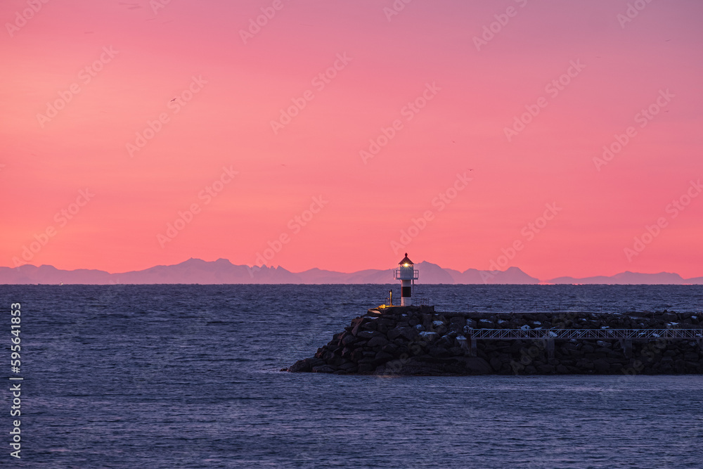A little lighthouse to bring you back home at sunset, with a lot of blank space. Warm pink tones and blues in shadows.